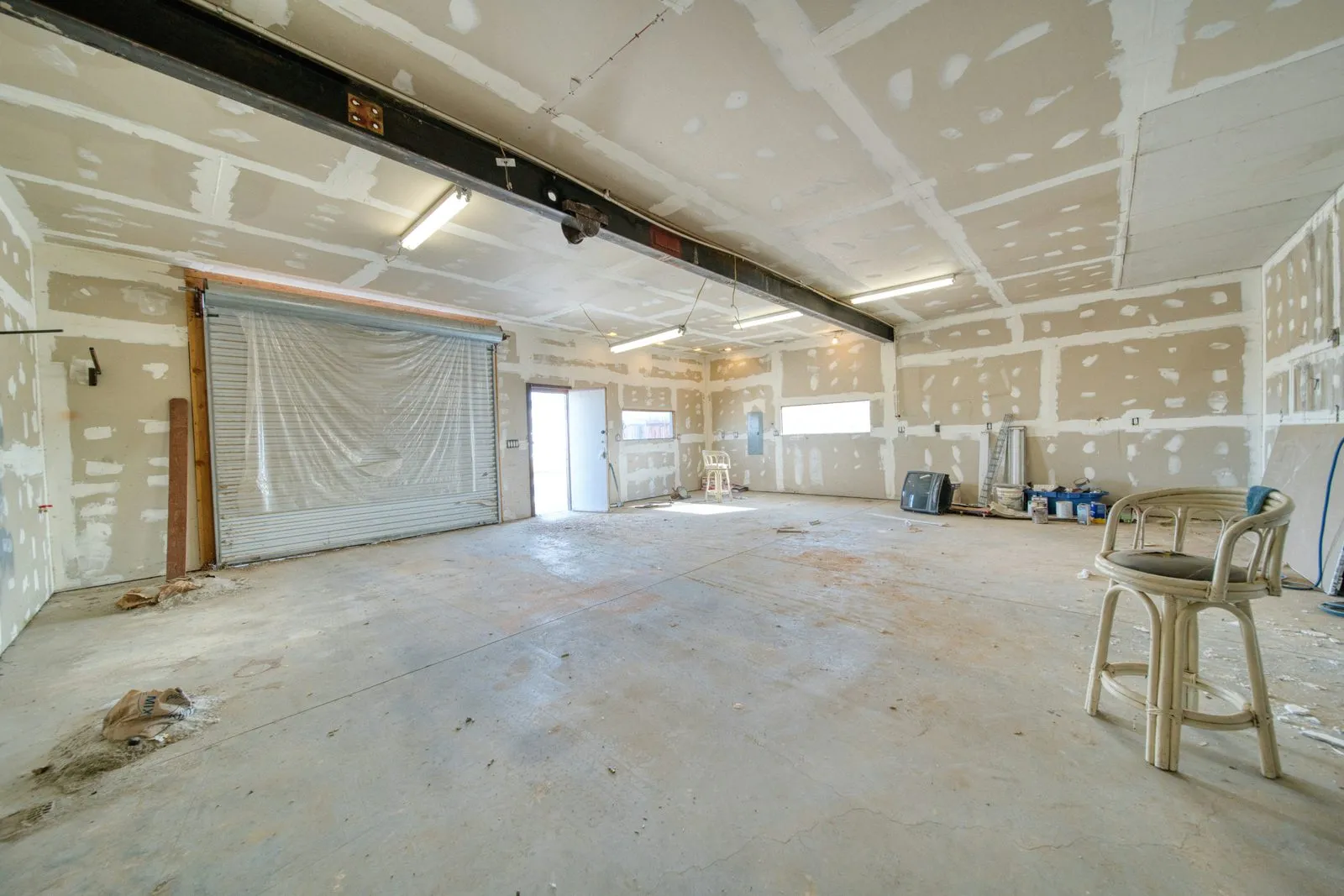 Drywall hung and taped across a large room