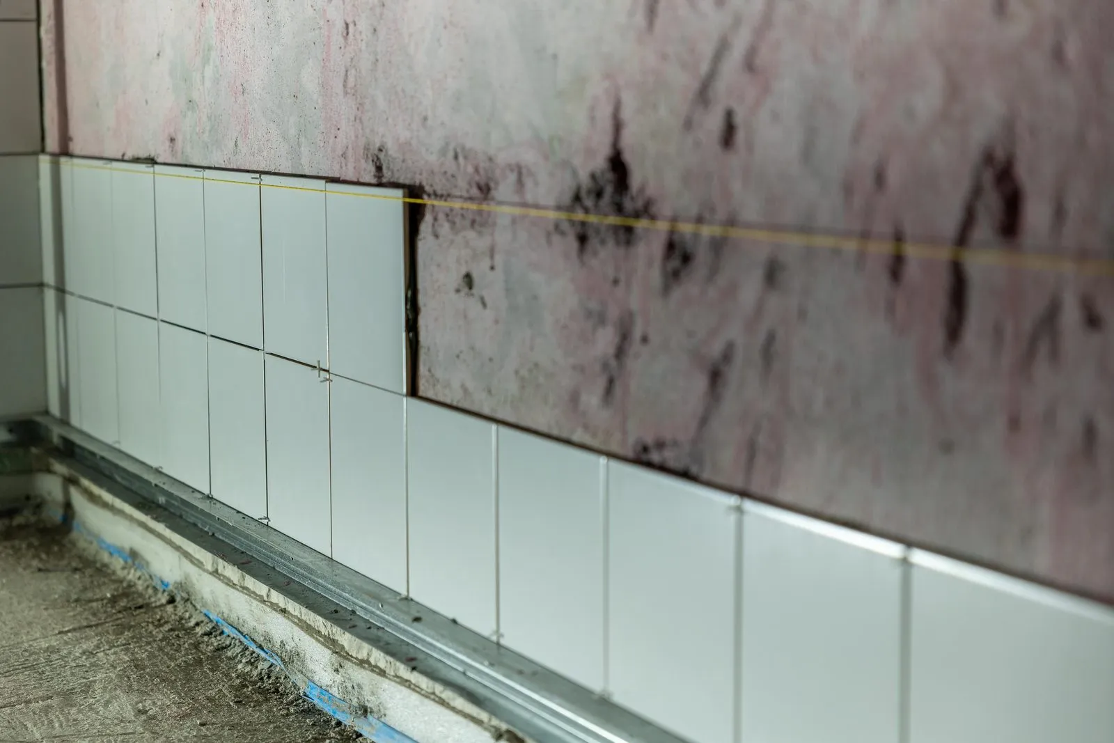 Tile going up along a wall