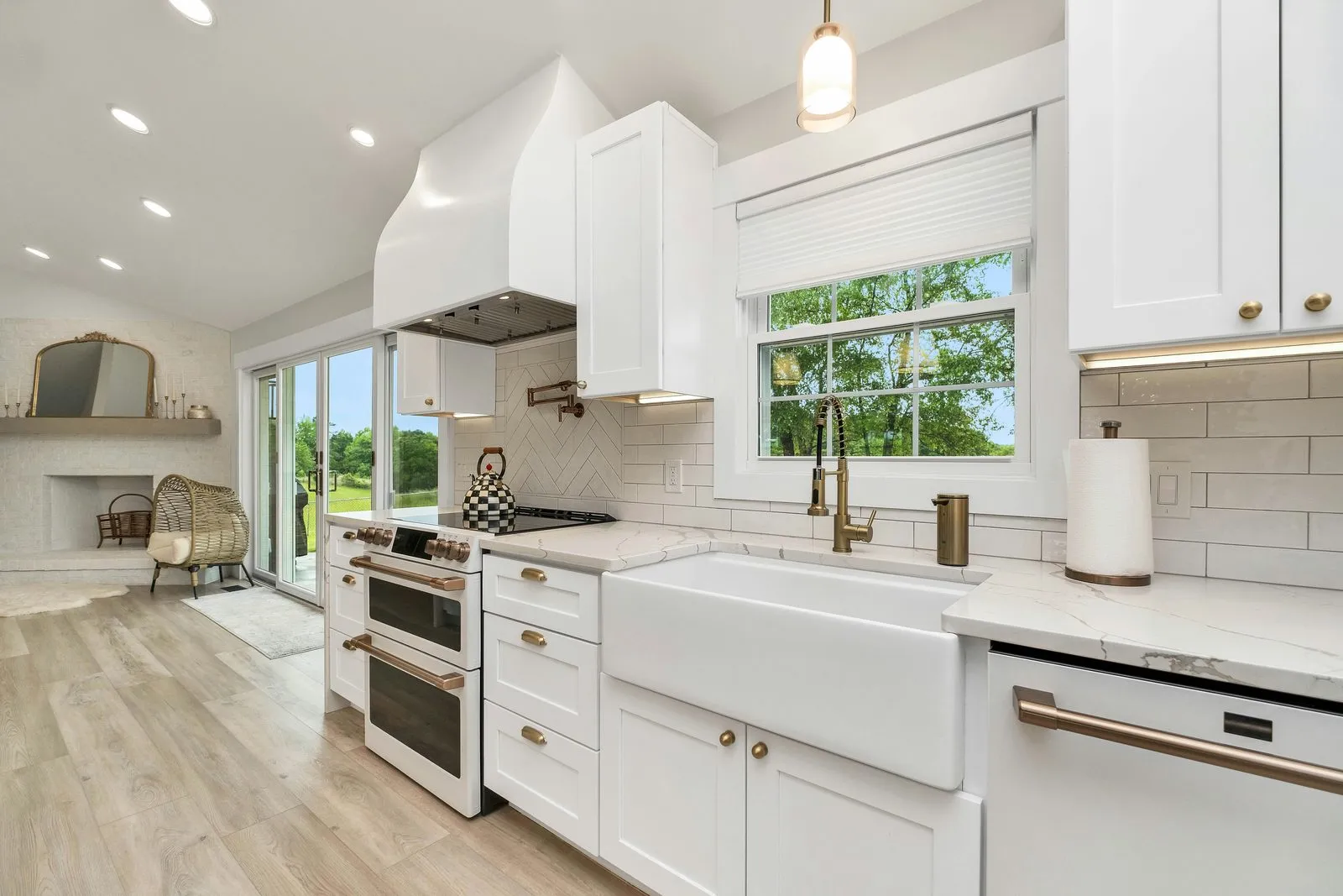 Finished white kitchen with a farmhouse sink