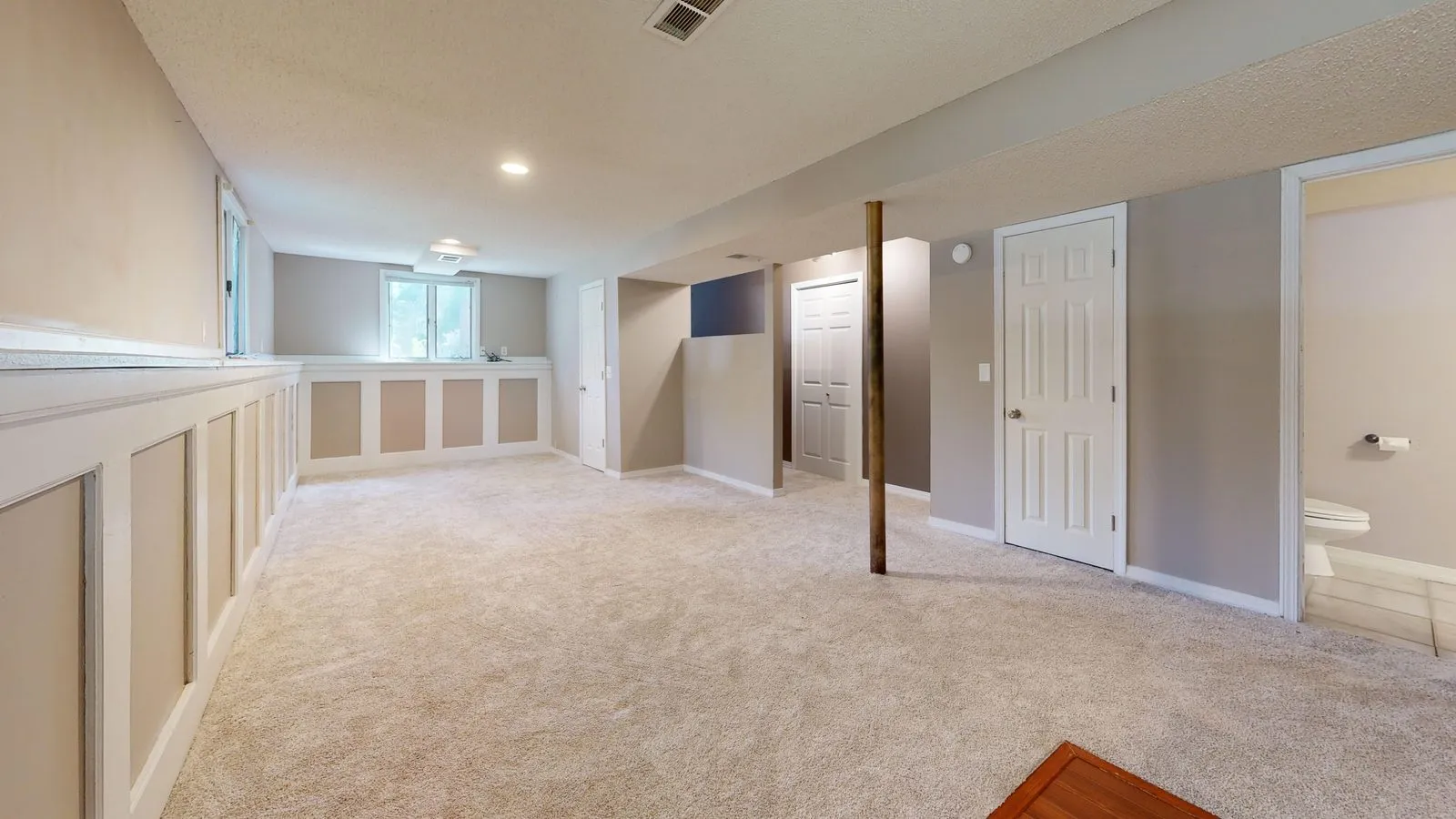 Finished basement rec room with new carpet
